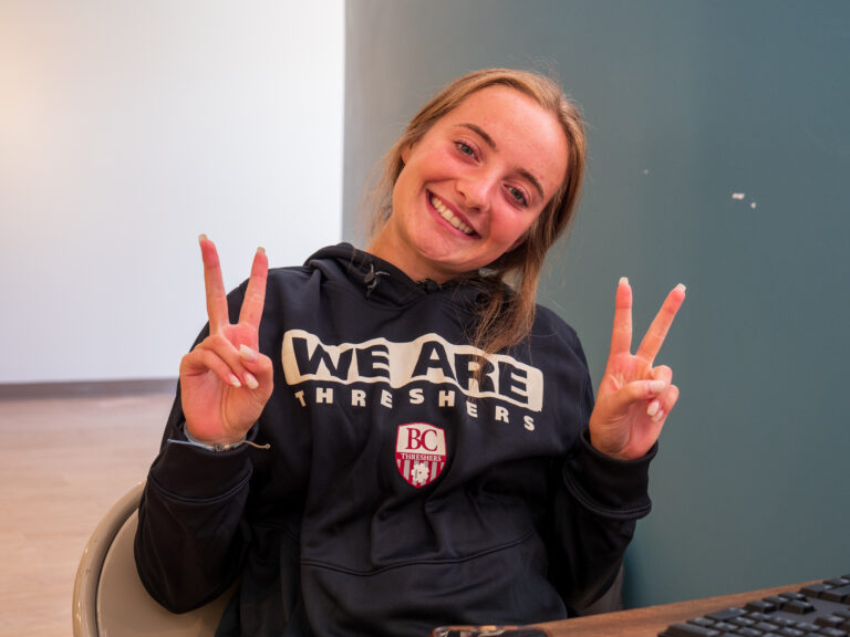 Girl wearing "We Are Threshers" sweatshirt