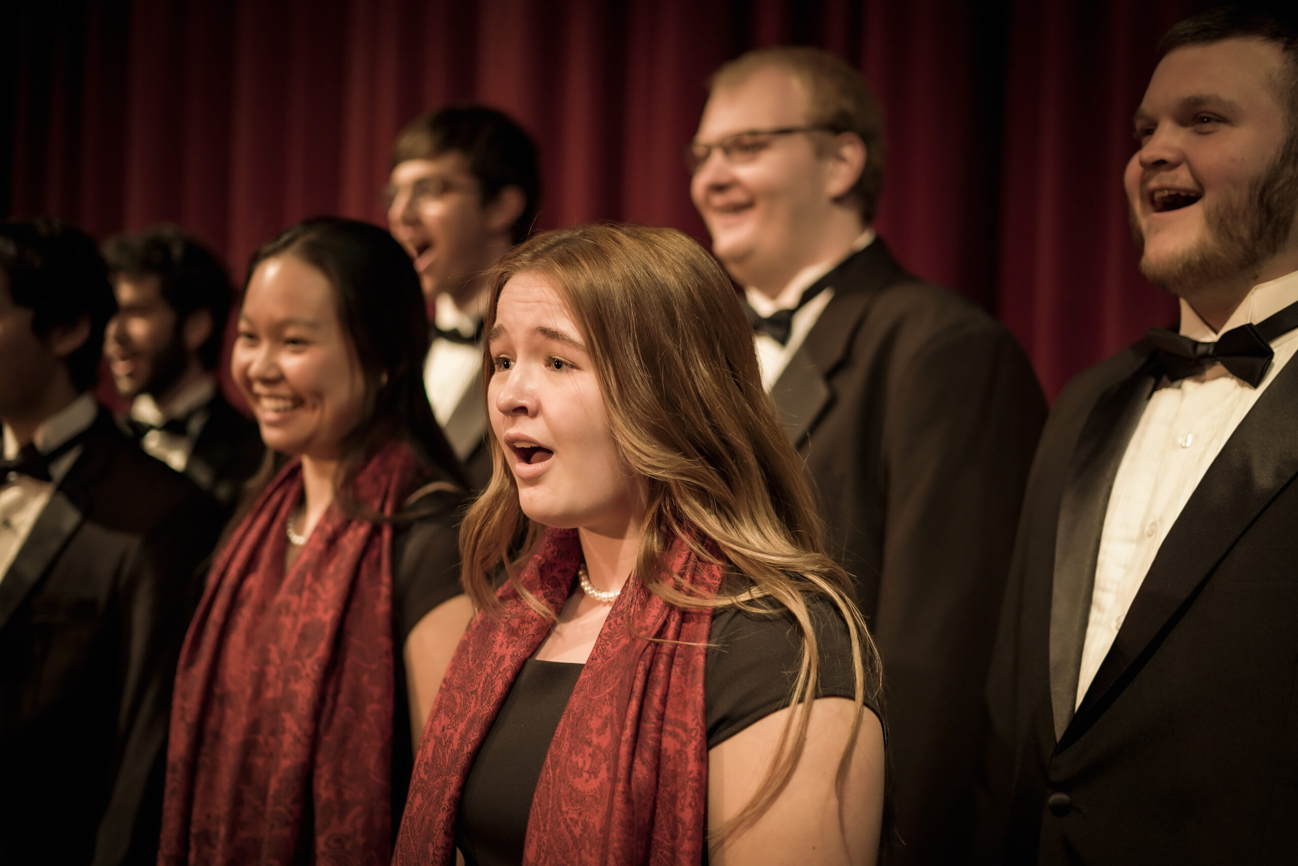 Close-up of Concert Choir singing in concert dress