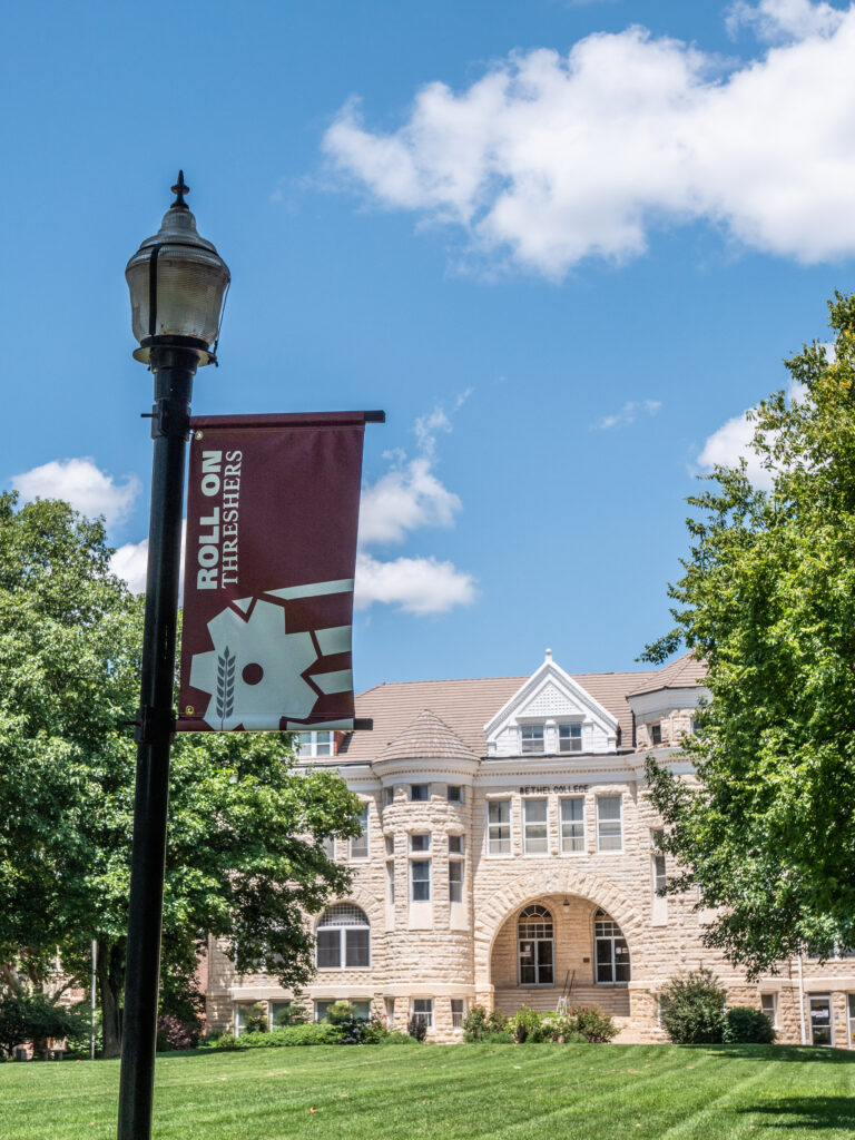 Roll On pole flag with Ad Building in the background