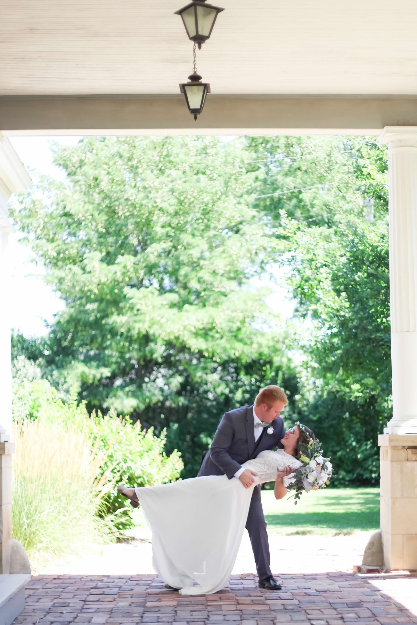 Wedding photo of Bailey Strausz & Ben Carlson outside Goerz House