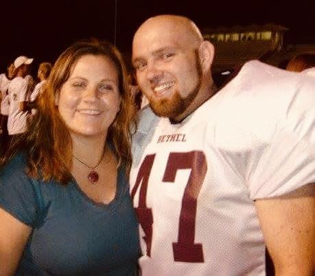 Jessica Yocum-Mefford & David Mefford on the football field with David in Thresher uniform (white)