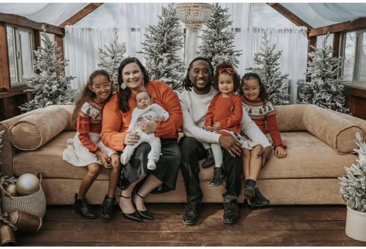 Megan & Jaylen Thompson on a couch with their four kids