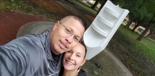 Selfie of Ben & Kamara with Friesen fountain behind them